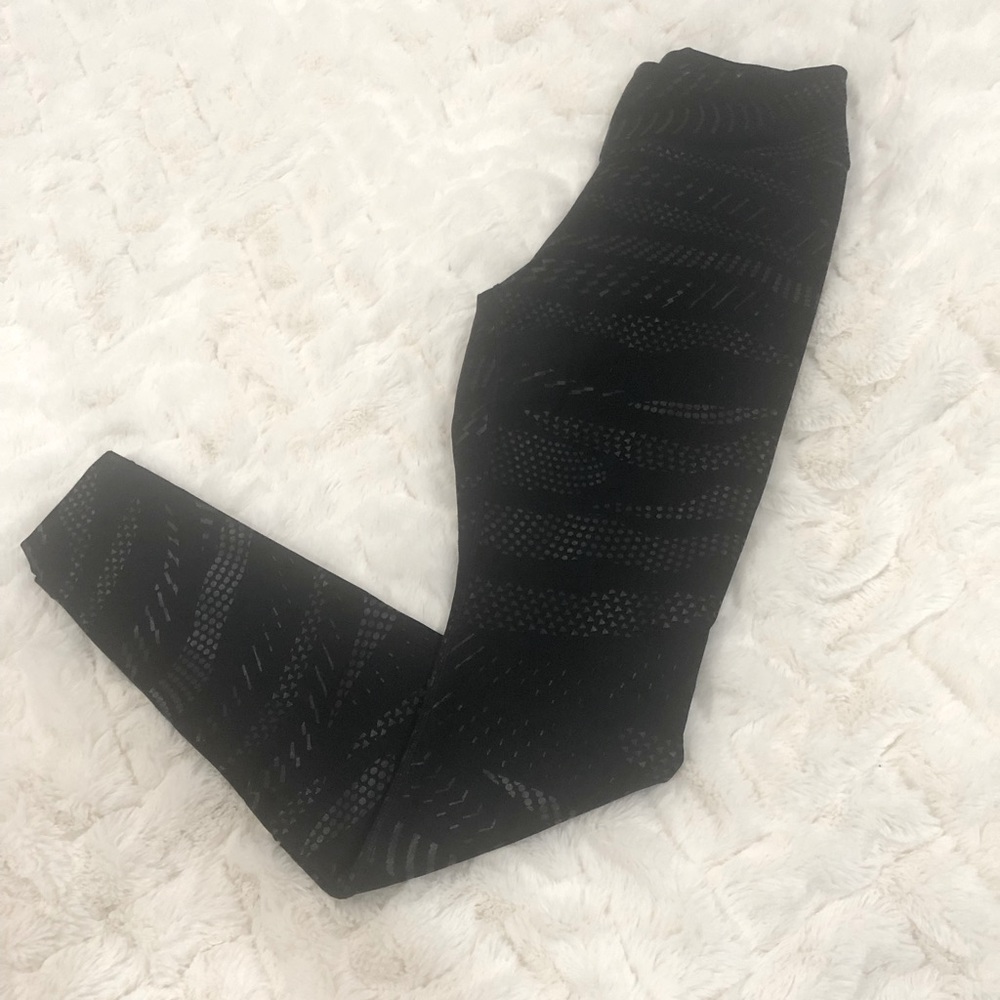 Gently used Nike XSmall black reflective design leggings